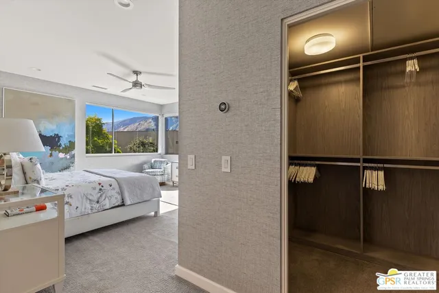 a bathroom with a shower a toilet and a sink