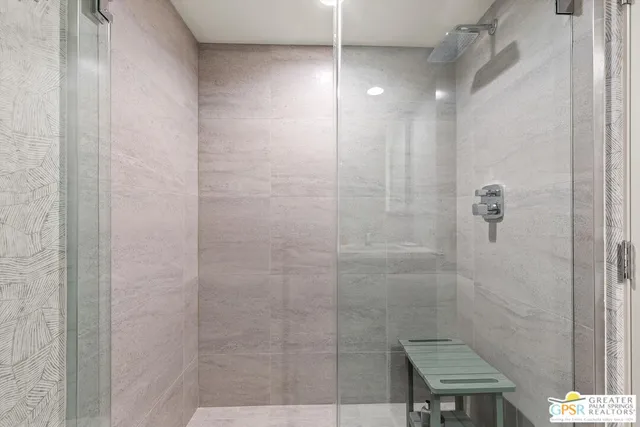 a bathroom with a double vanity sink toilet mirror and bathtub