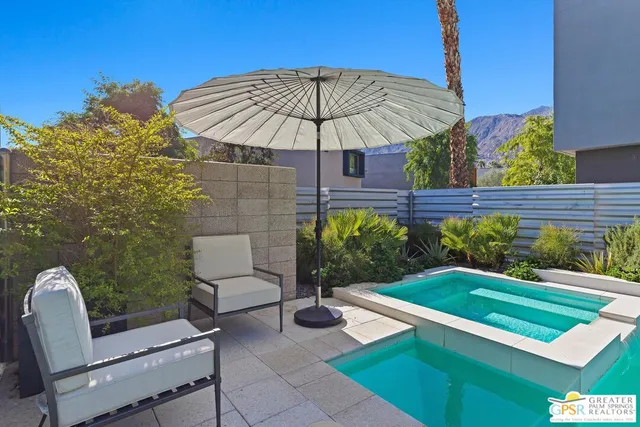 a view of a house with swimming pool