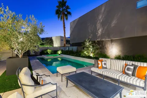 a view of a garden with sitting area