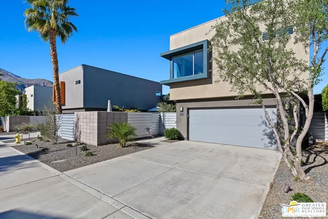 a view of backyard with outdoor seating a patio and plants