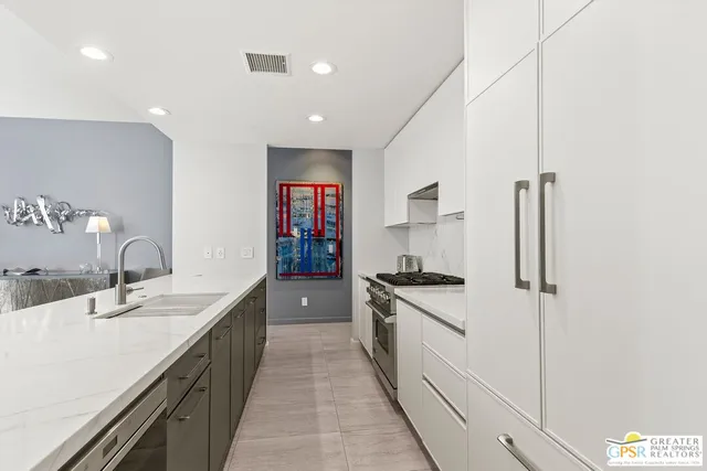 a kitchen with a table and chairs in it