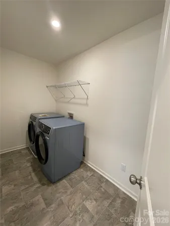 an empty room with wooden floor and sliding door