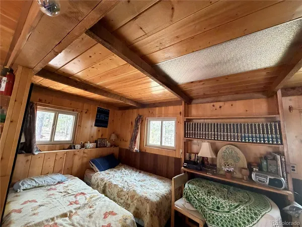 a bedroom with furniture and a window