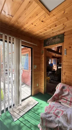 a view of a porch with a hanging couch
