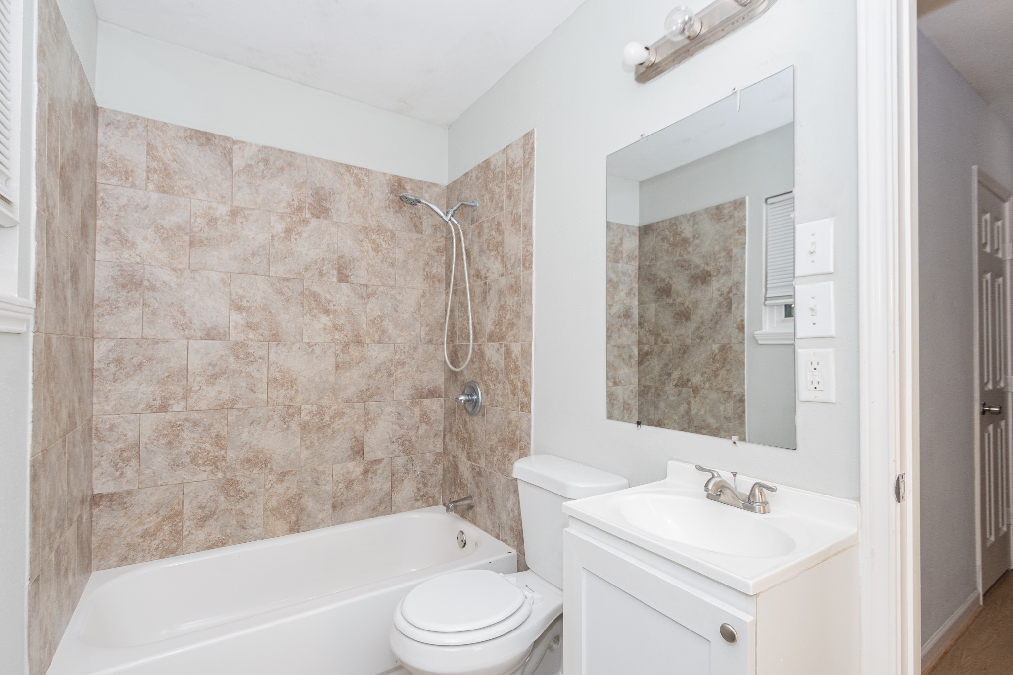 3707 Meadowlake Road Pasadena, TX 77503 - Photo 11 of 32 a bathroom with a sink toilet and shower