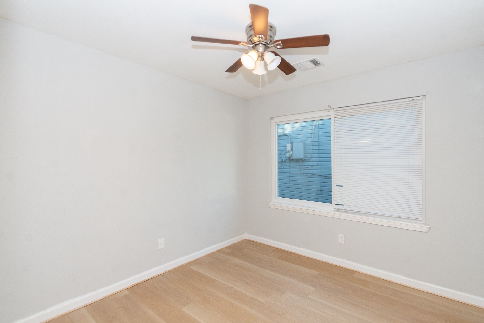 3707 Meadowlake Road Pasadena, TX 77503 - Photo 13 of 32 an empty room with a window and a fan