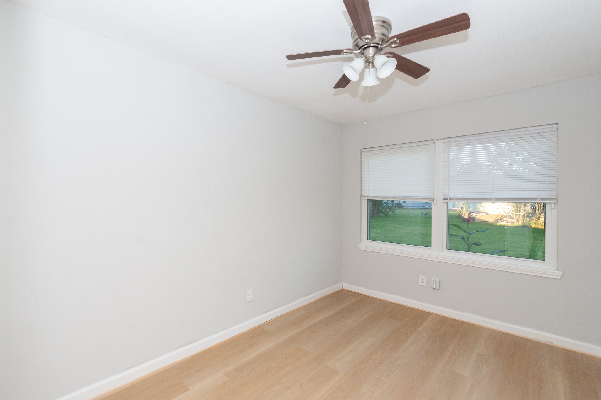 3707 Meadowlake Road Pasadena, TX 77503 - Photo 18 of 32 an empty room with a window and a fan