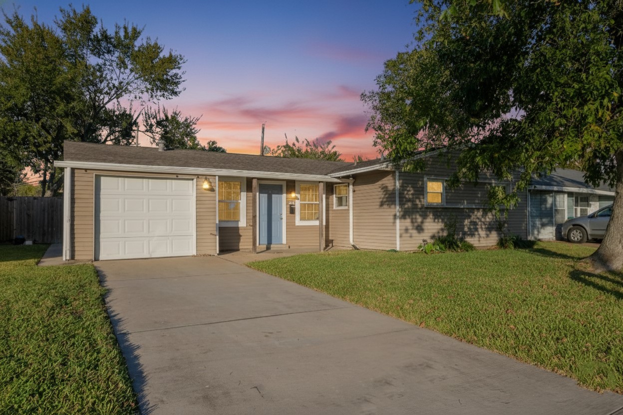 3707 Meadowlake Road Pasadena, TX 77503 - Photo 2 of 32 front view of a house with a yard and potted plants