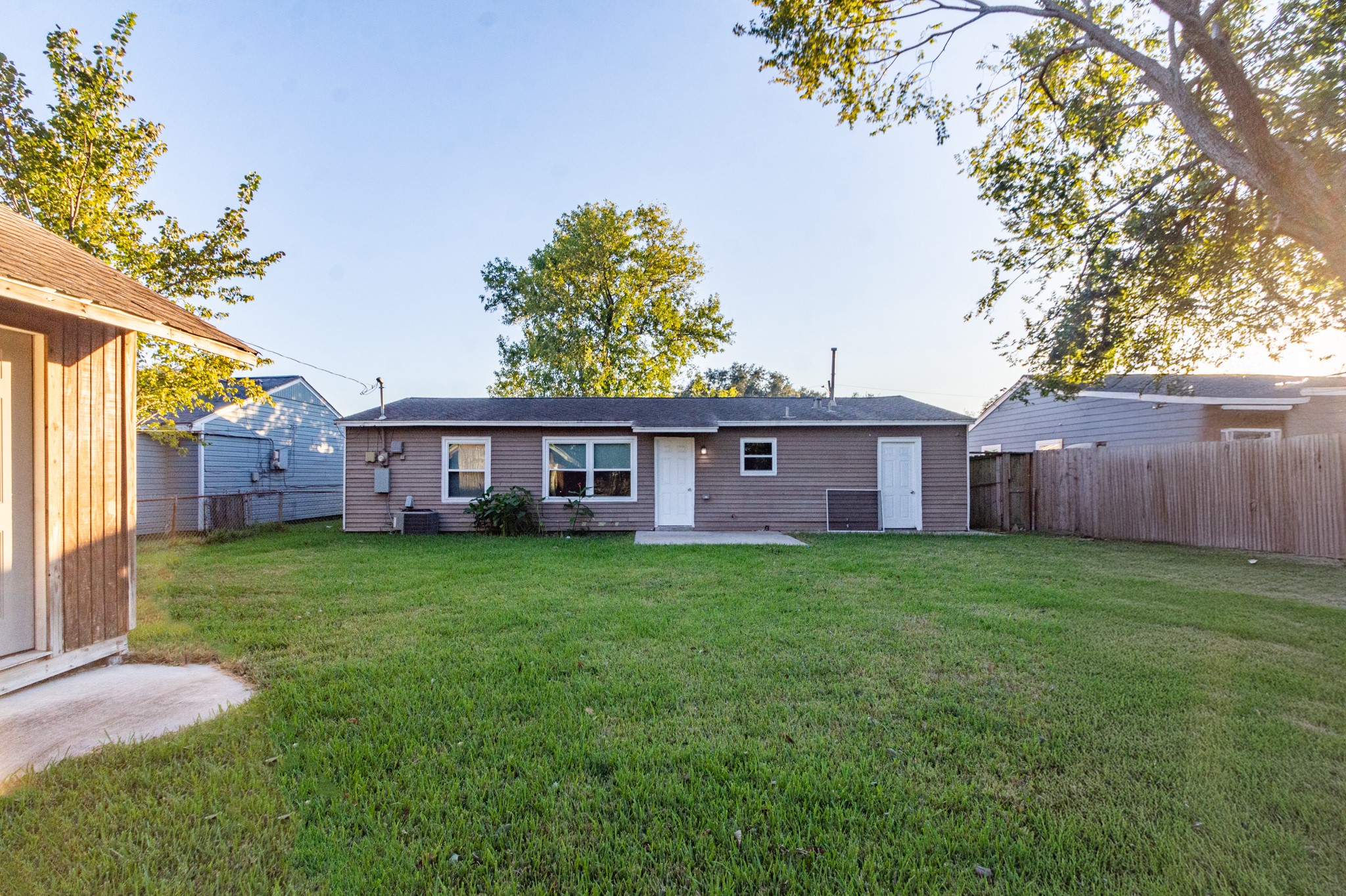 3707 Meadowlake Road Pasadena, TX 77503 - Photo 23 of 32 a view of a yard in front of a house with large tree