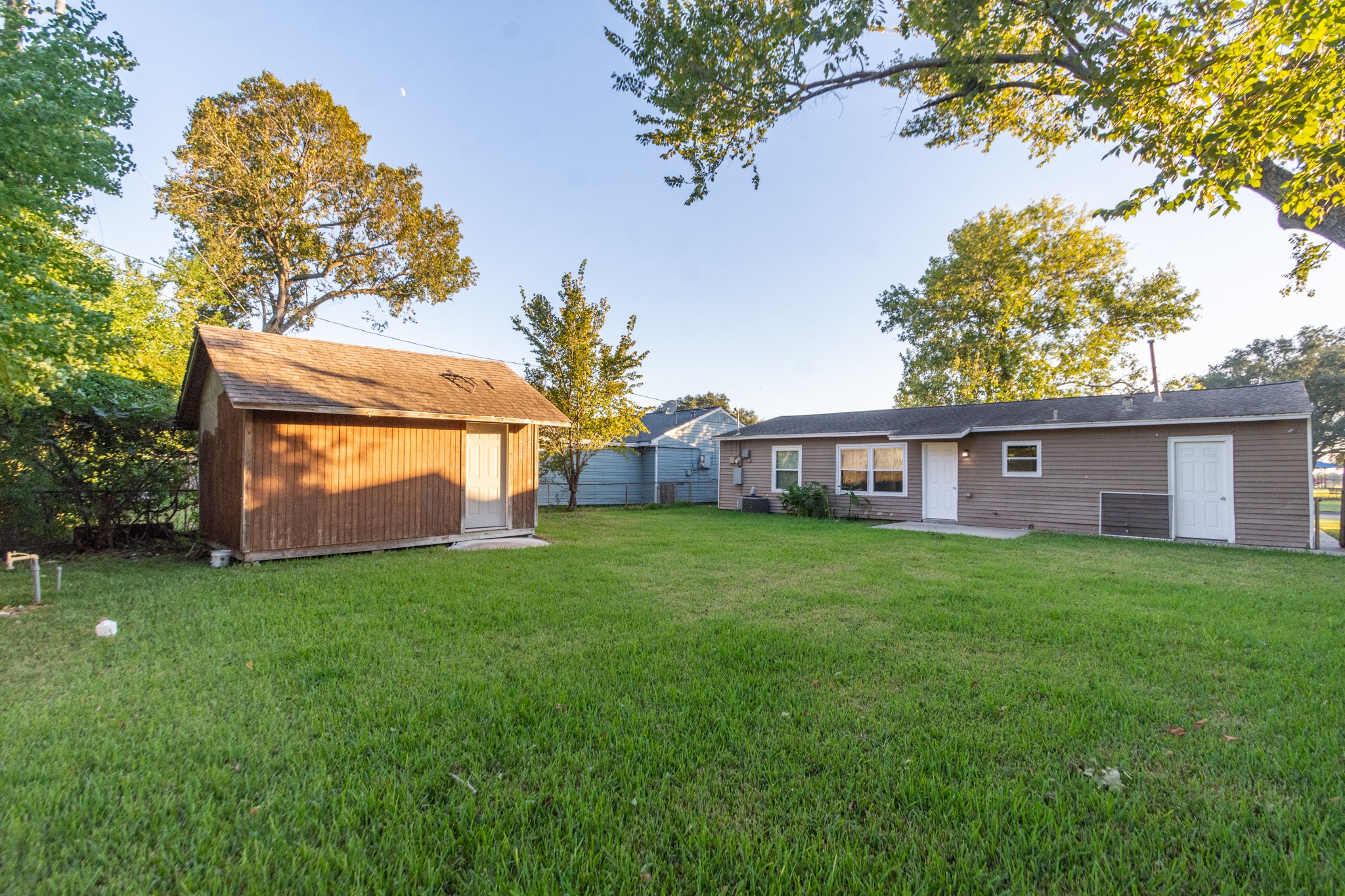 3707 Meadowlake Road Pasadena, TX 77503 - Photo 25 of 32 a view of a yard in front of a house with large tree