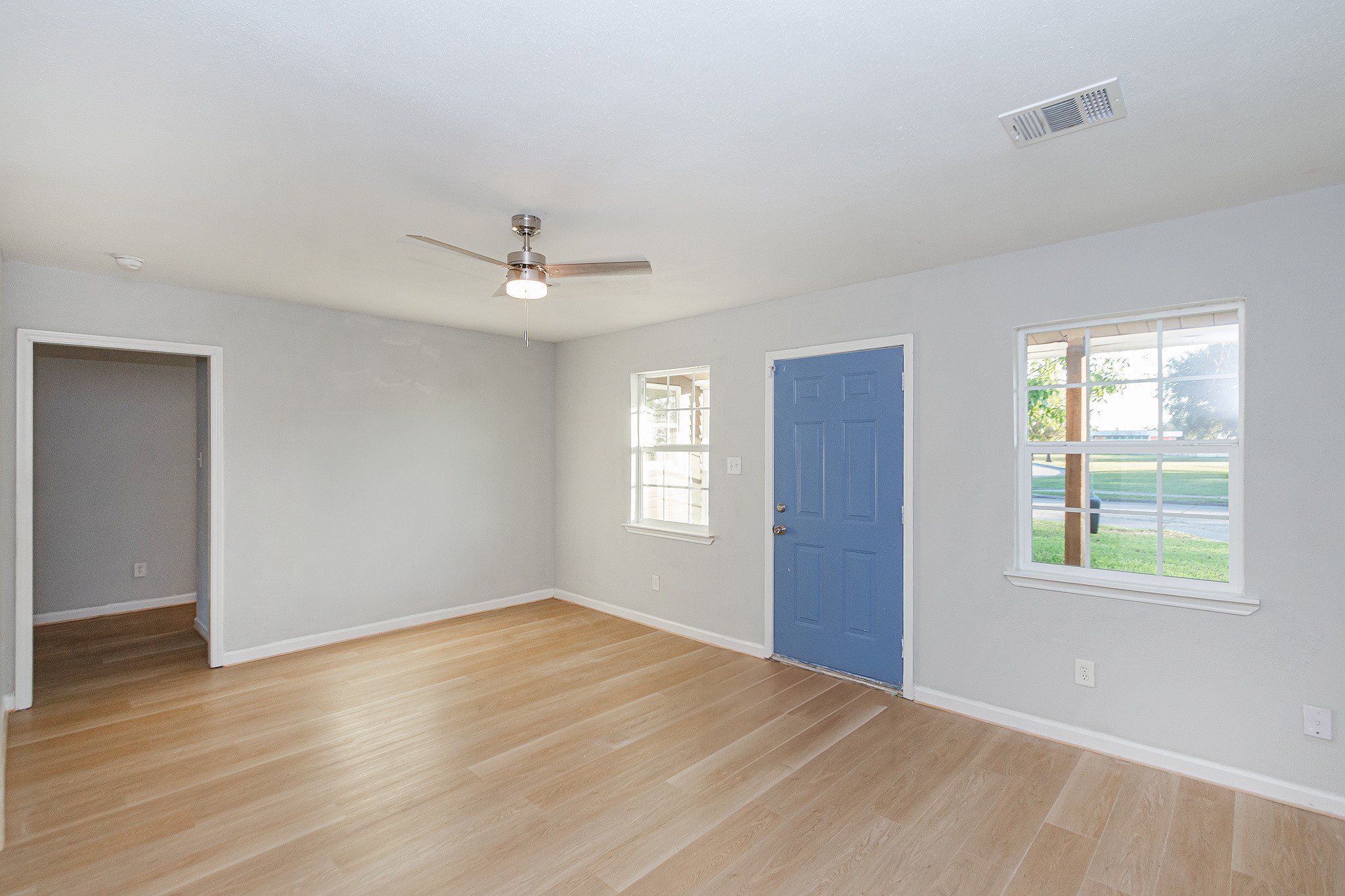 3707 Meadowlake Road Pasadena, TX 77503 - Photo 4 of 32 a view of an empty room with wooden floor and a window