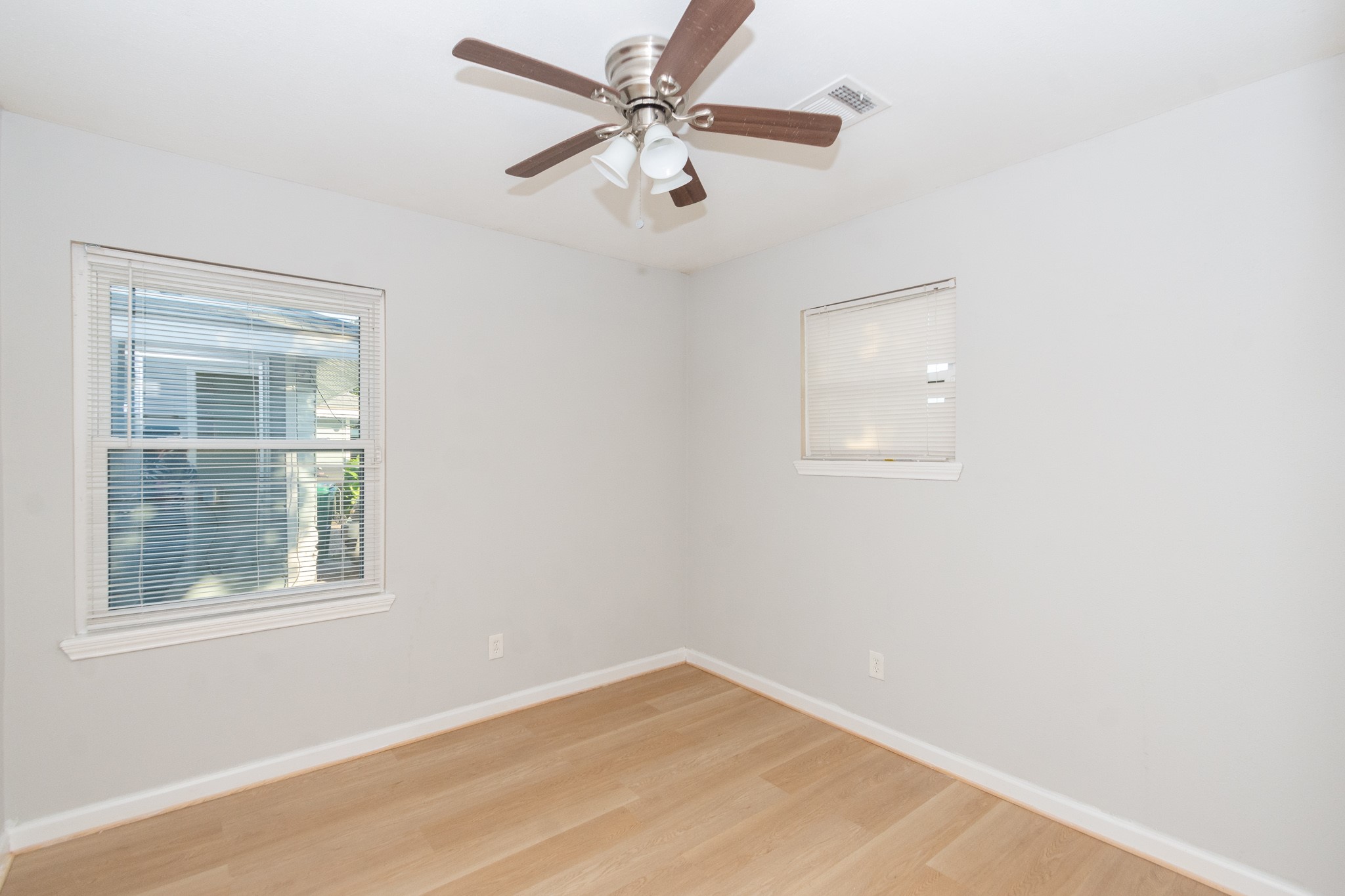 3707 Meadowlake Road Pasadena, TX 77503 - Photo 9 of 32 an empty room with a window and a fan