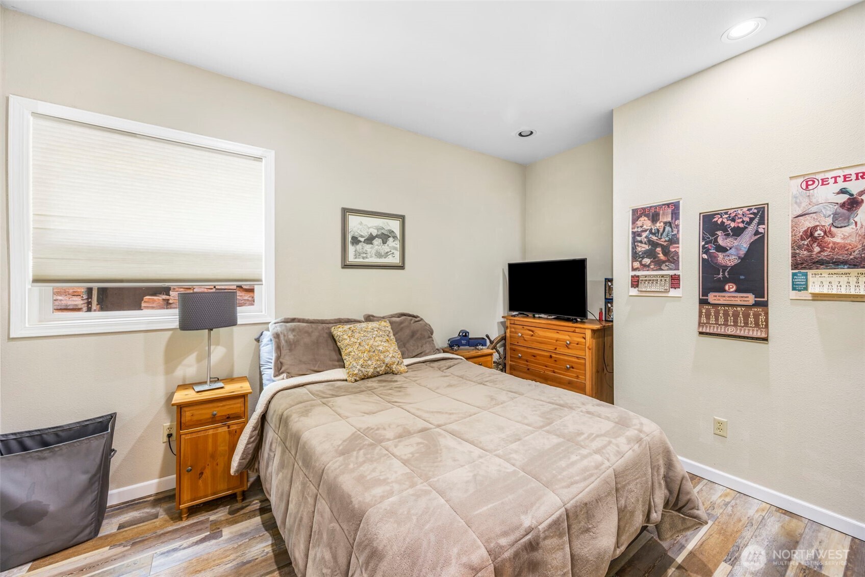 6591 Northeast North Shore Road Belfair, WA 98528 - Photo 35 of 37 a bedroom with a bed and wooden floor