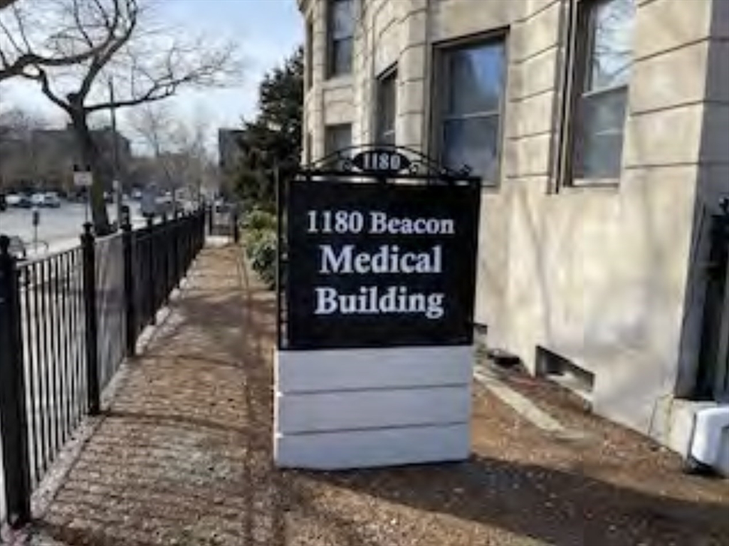 1180 Beacon Street, Unit 7C Brookline, MA 02446 - Photo 2 of 3 a view of a street with parking space