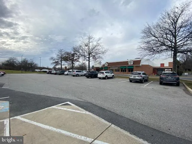 a view of a city street with parked cars