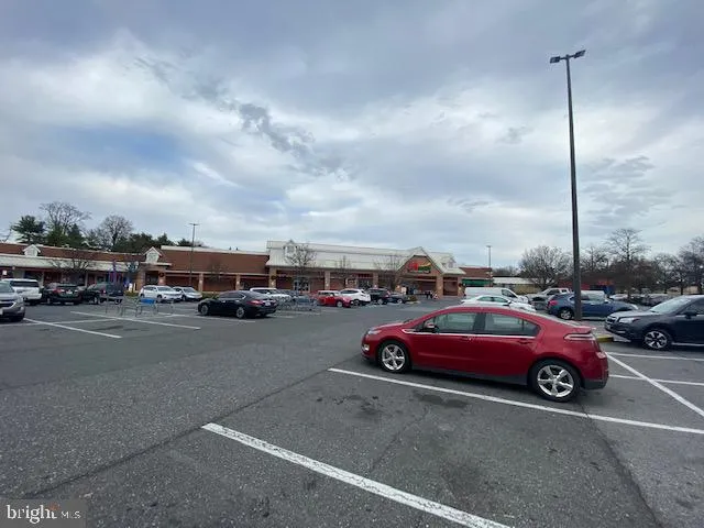 a view of street with parked cars
