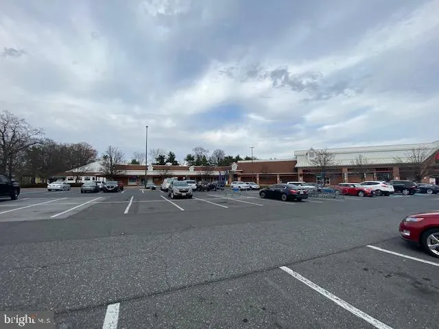 a view of swimming pool and trees in the background