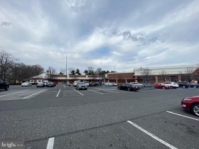 5860 Thunder Hill Road, Unit B2 Columbia, MD 21045 - Photo 28 of 35 a view of a city street with parked cars