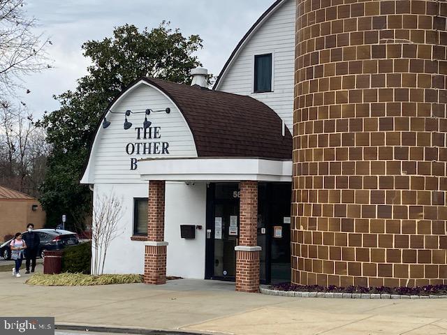 5860 Thunder Hill Road, Unit B2 Columbia, MD 21045 - Photo 34 of 35 a view of a brick house with many windows