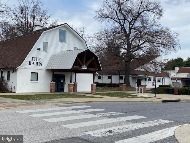 5860 Thunder Hill Road, Unit B2 Columbia, MD 21045 - Photo 35 of 35 a view of a house with a yard and large trees