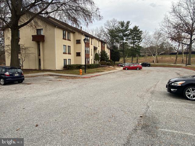 5860 Thunder Hill Road, Unit B2 Columbia, MD 21045 - Photo 4 of 35 a view of street with parked cars