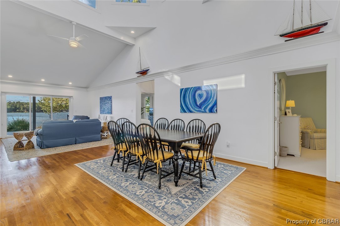 192 Bayberry Point Lane Kilmarnock, VA 22482 - Photo 19 of 49 Hardwood floored dining area featuring vaulted ceiling with beams and a high ceiling
