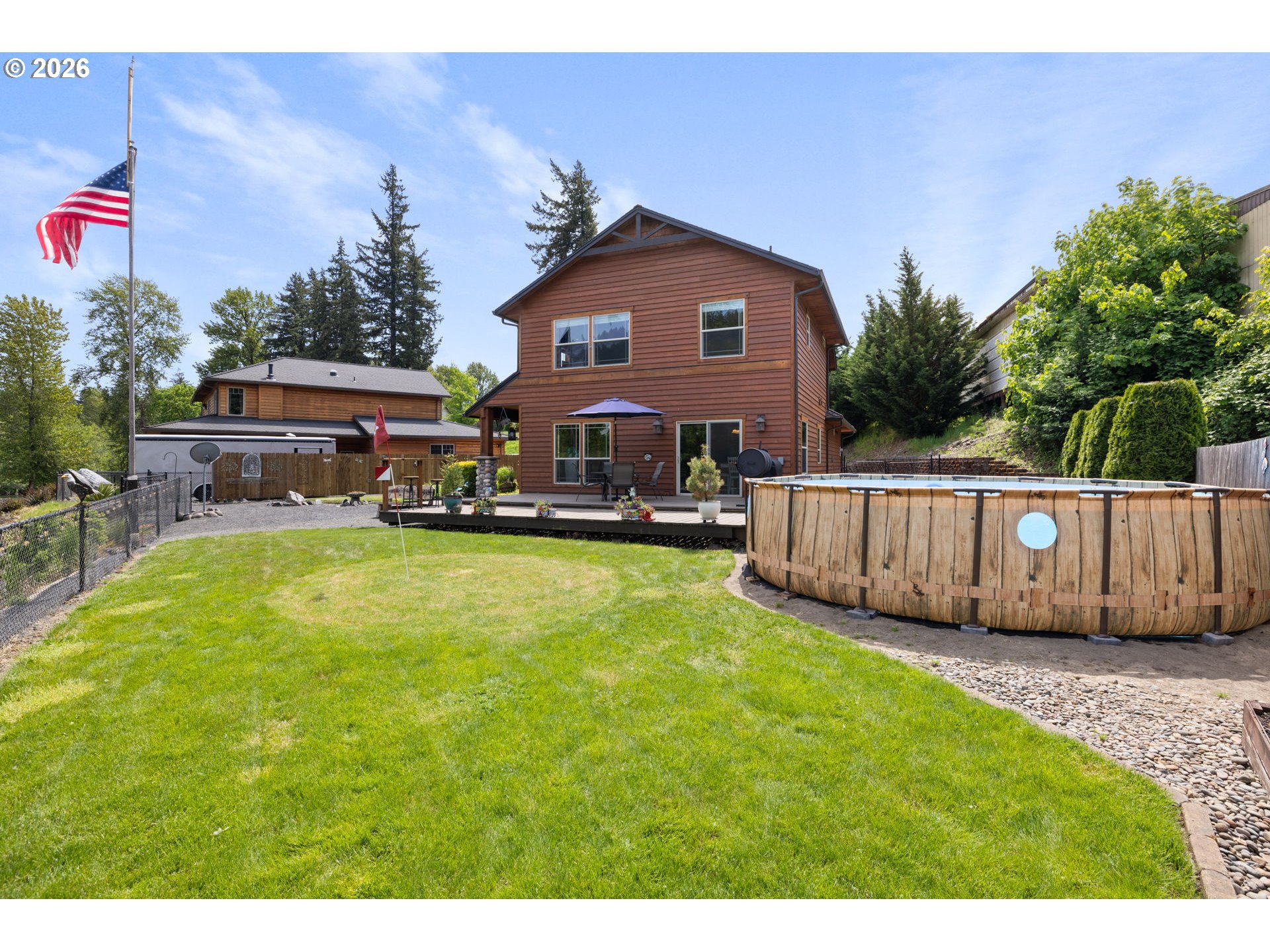 210 Southeast Whitten Road Mill City, OR 97360 - Photo 6 of 48 a view of an house with backyard and swimming pool