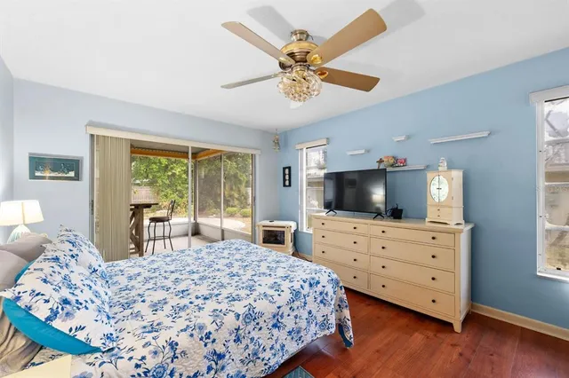 a bedroom with a bed and flat screen tv