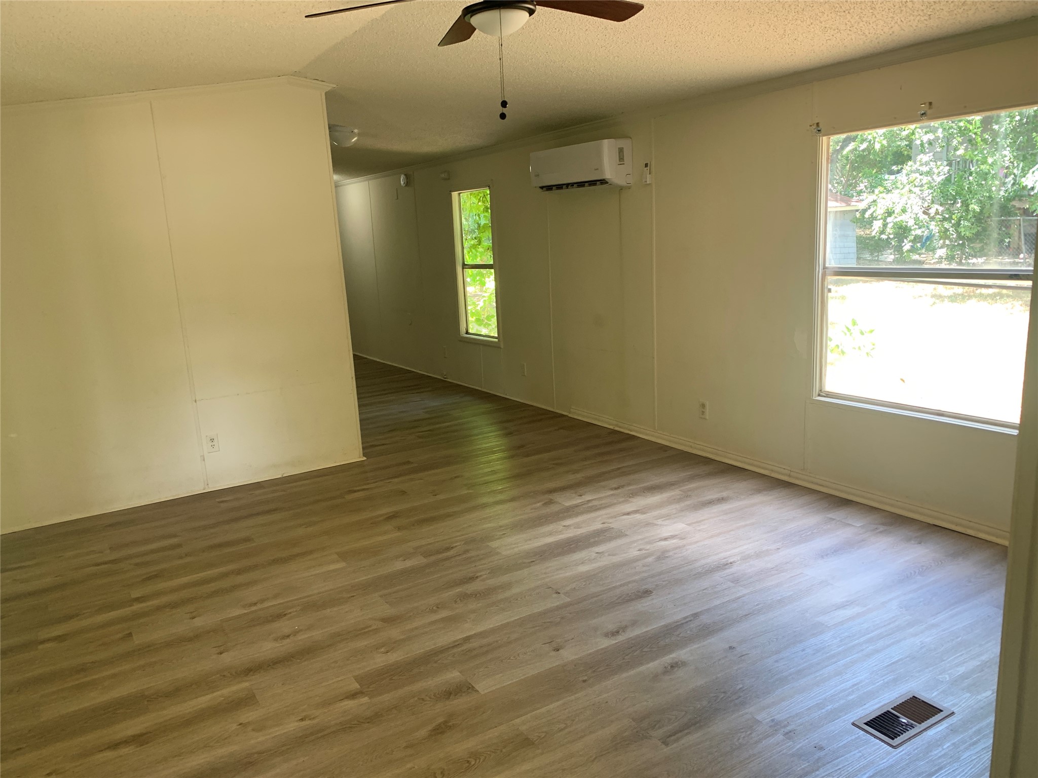 9903 Cheryl Lynn Road Austin, TX 78747 - Photo 13 of 13 An open floorplan with durable laminate flooring and abundant natural light.
