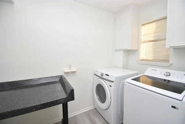 a view of a room with a hanging light