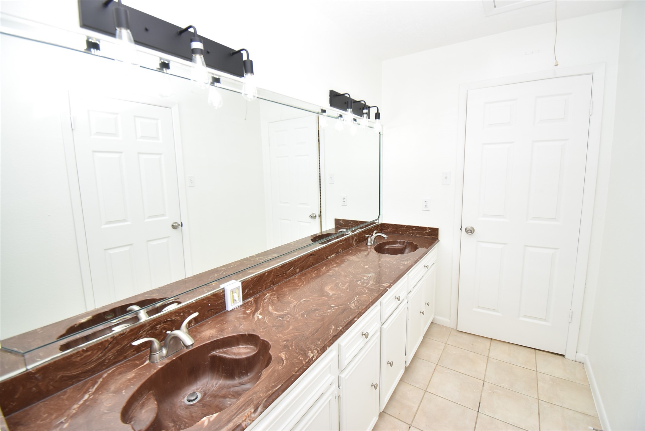 82 Harbor Lane Kemah, TX 77565 - Photo 23 of 33 a bathroom with a granite countertop sink and a mirror