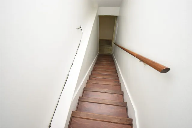 a white toilet sitting next to a bathroom sink