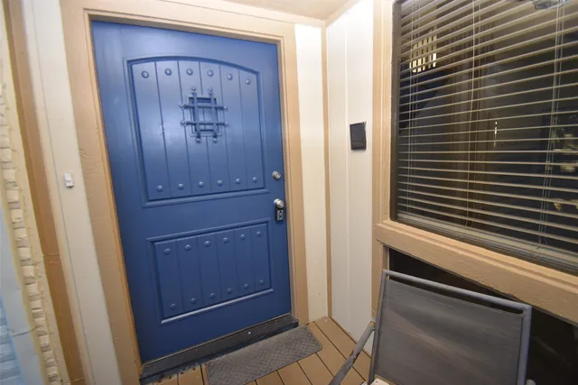a view of bathroom with a door
