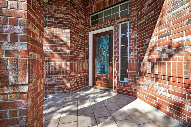 a view of a brick building with many windows