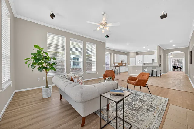 a dining room with furniture a fireplace and wooden floor