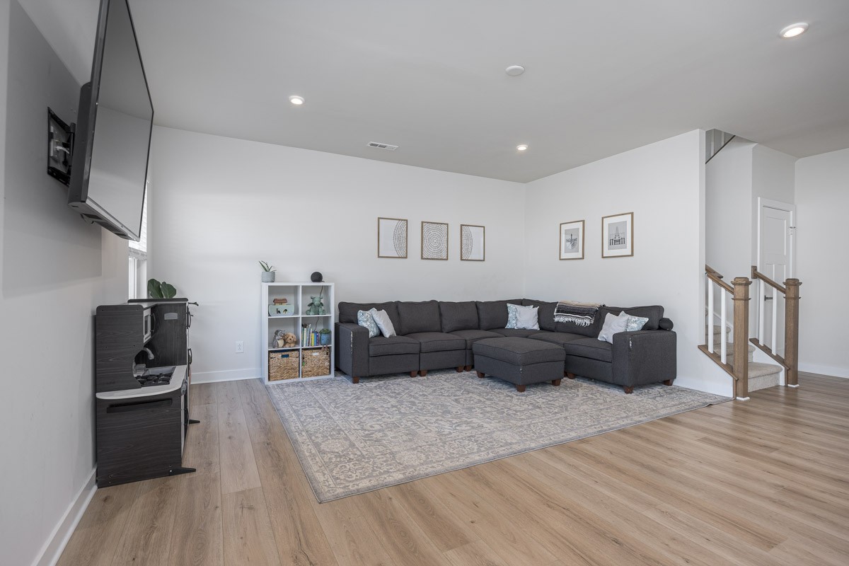3232 Firerock Drive Murfreesboro, TN 37128 - Photo 12 of 45 a living room with furniture and a flat screen tv