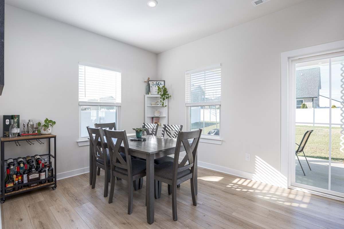3232 Firerock Drive Murfreesboro, TN 37128 - Photo 23 of 45 a view of a a dining room with furniture window and wooden floor