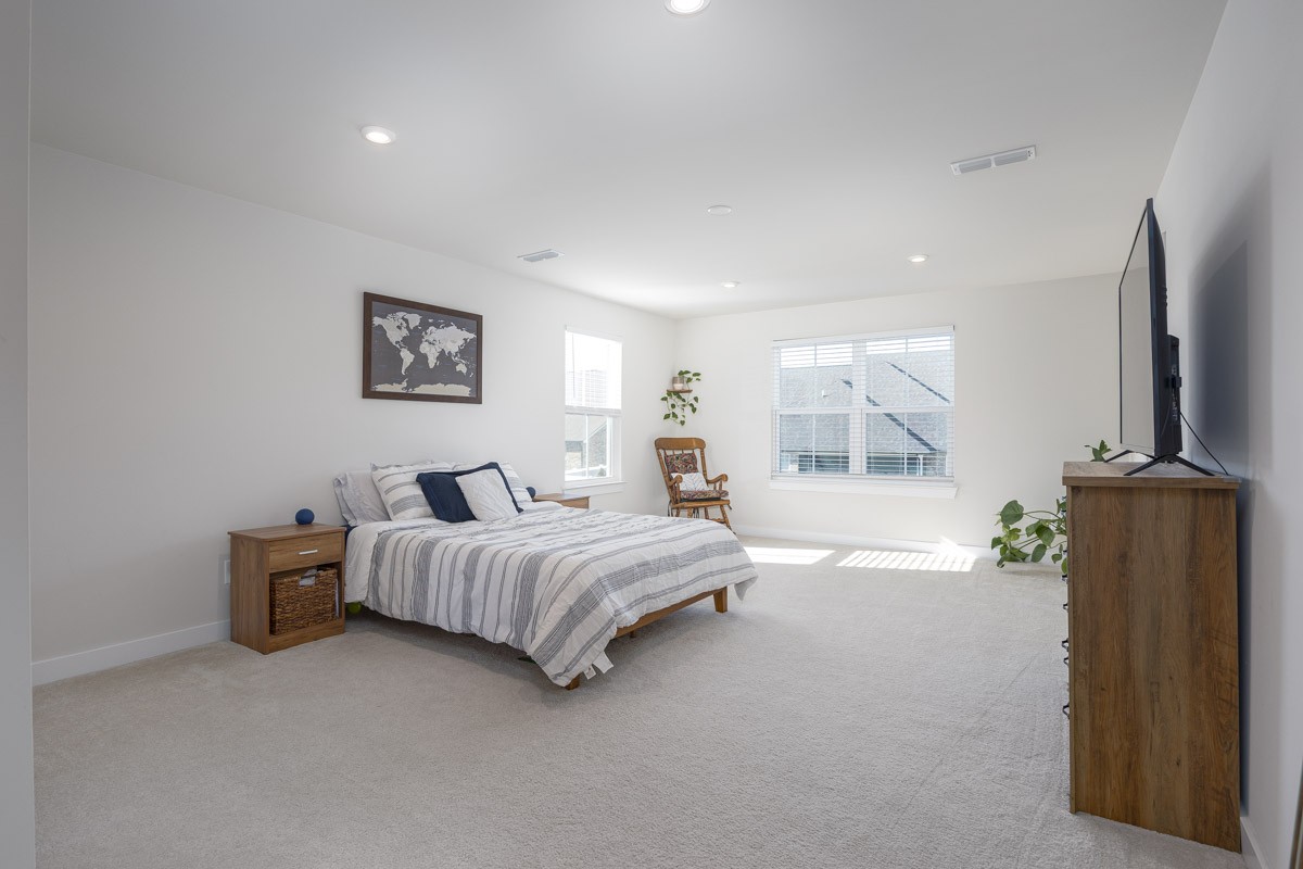 3232 Firerock Drive Murfreesboro, TN 37128 - Photo 24 of 45 a spacious bedroom with a bed and a flat screen tv