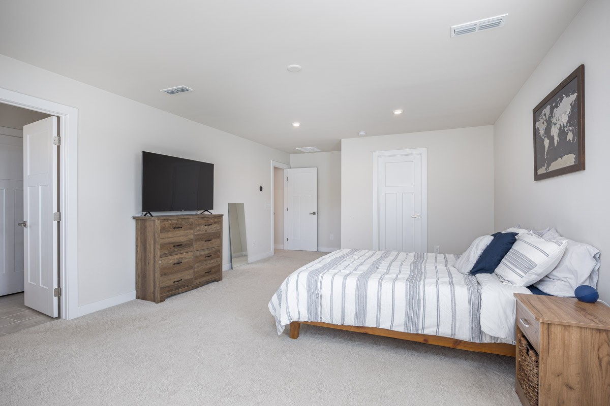 3232 Firerock Drive Murfreesboro, TN 37128 - Photo 25 of 45 a bedroom with a bed and a flat screen tv