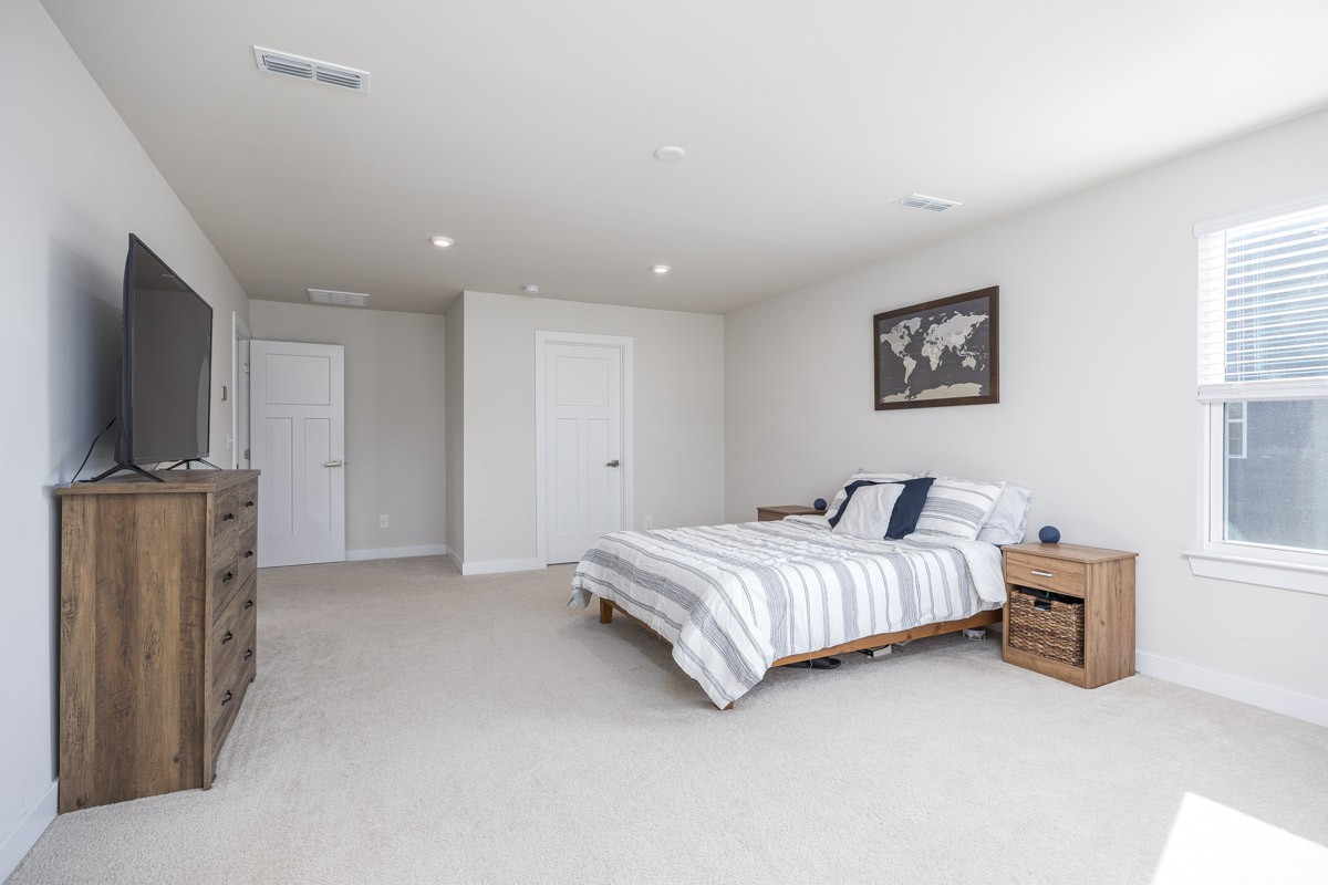 3232 Firerock Drive Murfreesboro, TN 37128 - Photo 28 of 45 a spacious bedroom with a bed and a flat screen tv