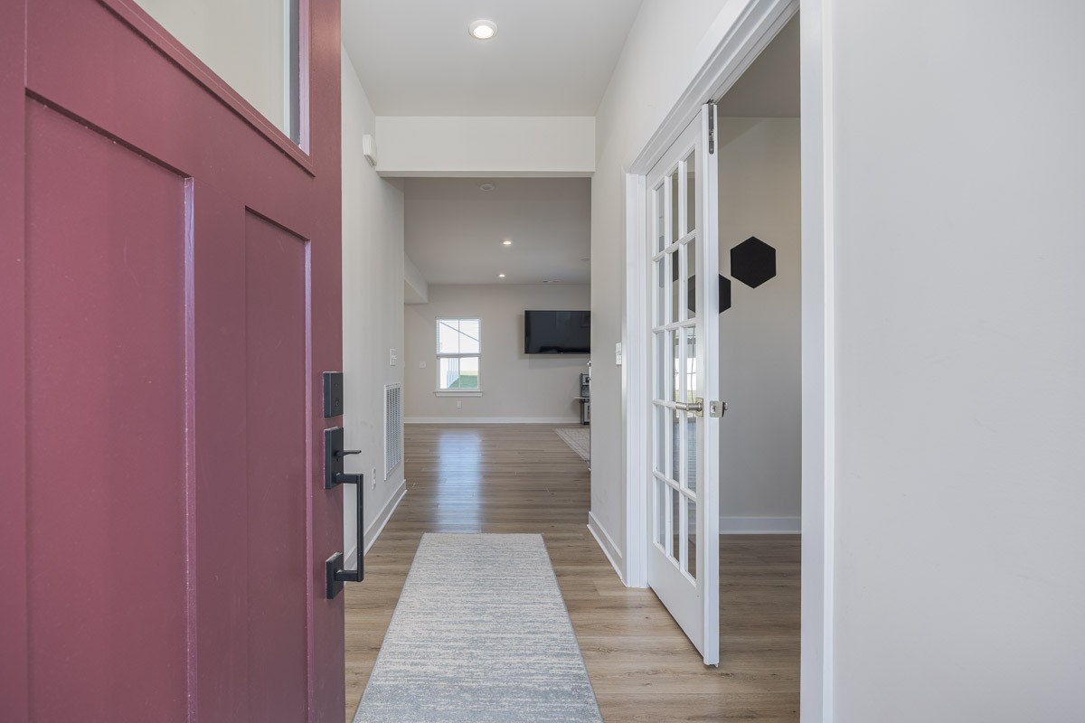 3232 Firerock Drive Murfreesboro, TN 37128 - Photo 6 of 45 a view of a hallway with a livingroom and a bathroom with sink