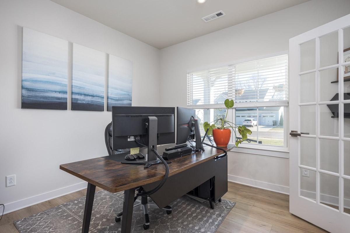 3232 Firerock Drive Murfreesboro, TN 37128 - Photo 9 of 45 a room with furniture a window and a flat screen tv