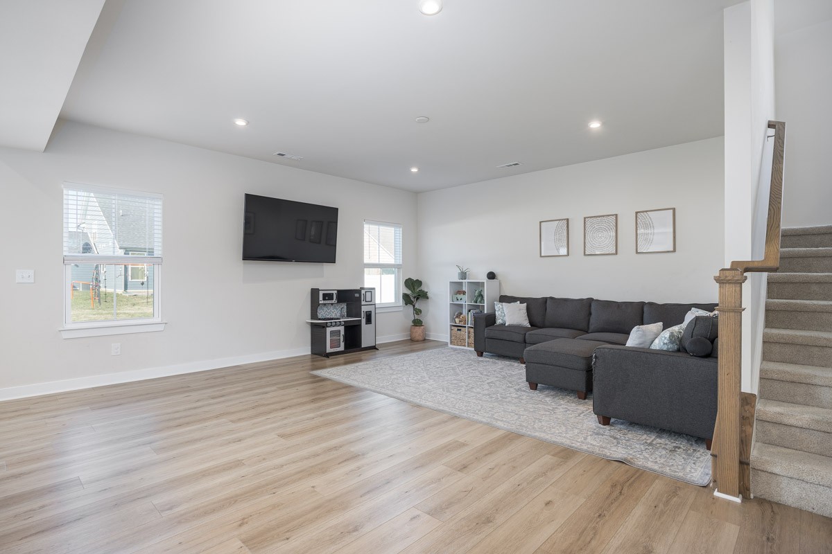 3232 Firerock Drive Murfreesboro, TN 37128 - Photo 10 of 45 a living room with furniture and a flat screen tv