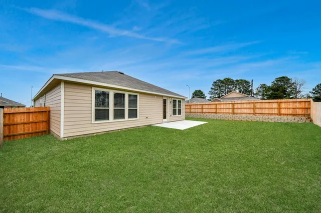 an aerial view of multiple houses with outdoor space