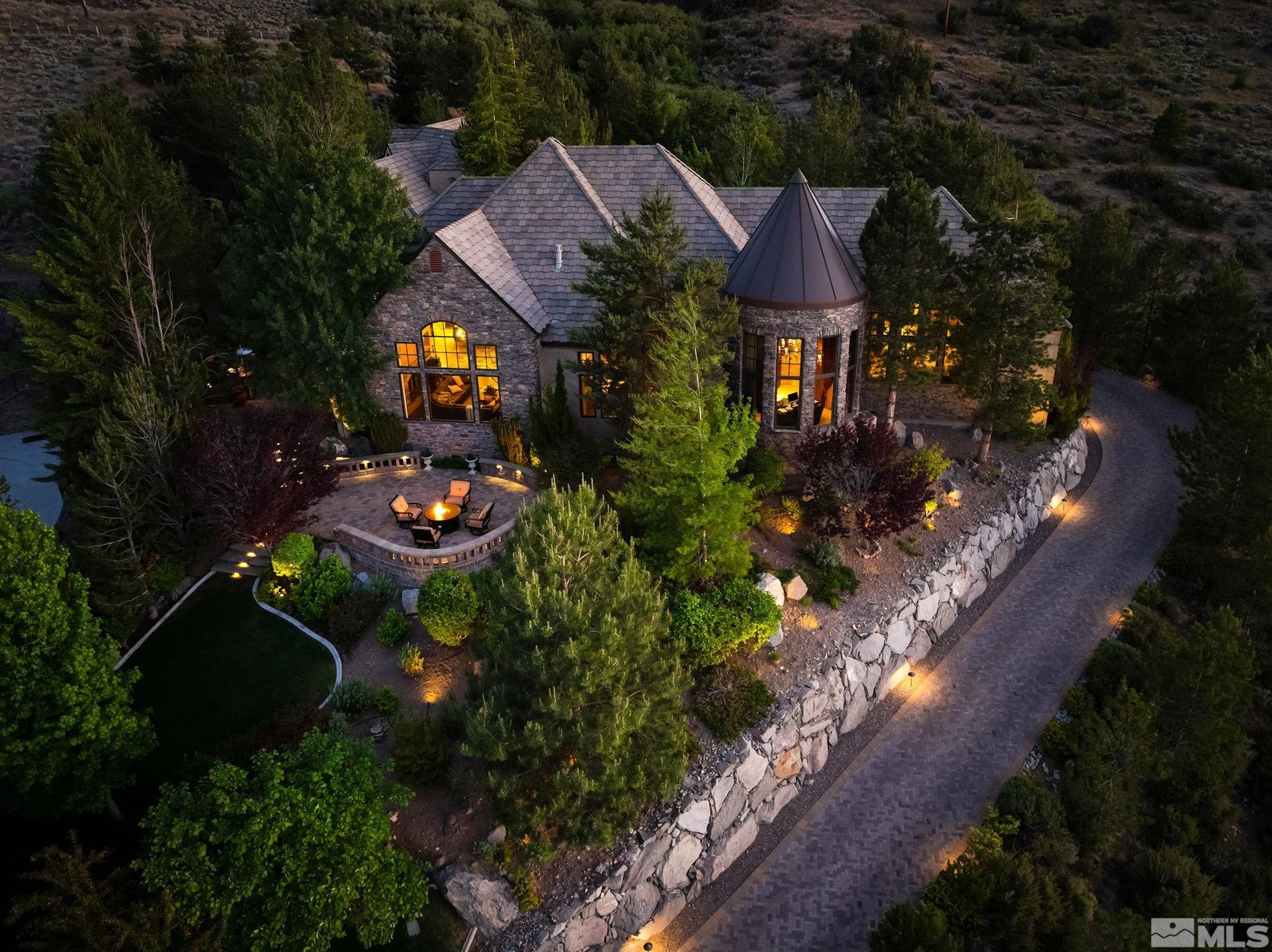 an aerial view of a house with garden space and street view
