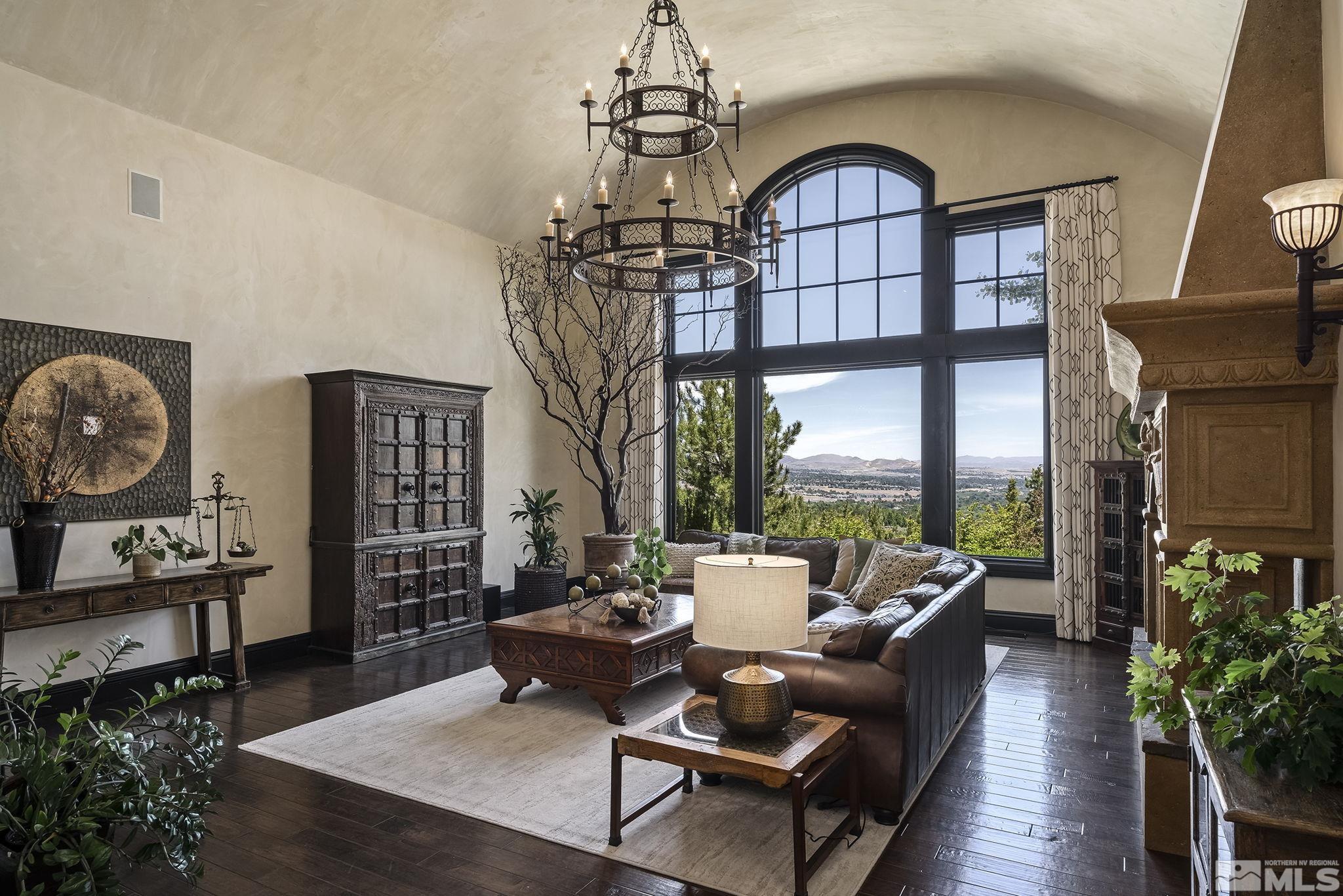 90 Hawken Road Reno, NV 89519 - Photo 11 of 40 a living room with furniture a window and a chandelier