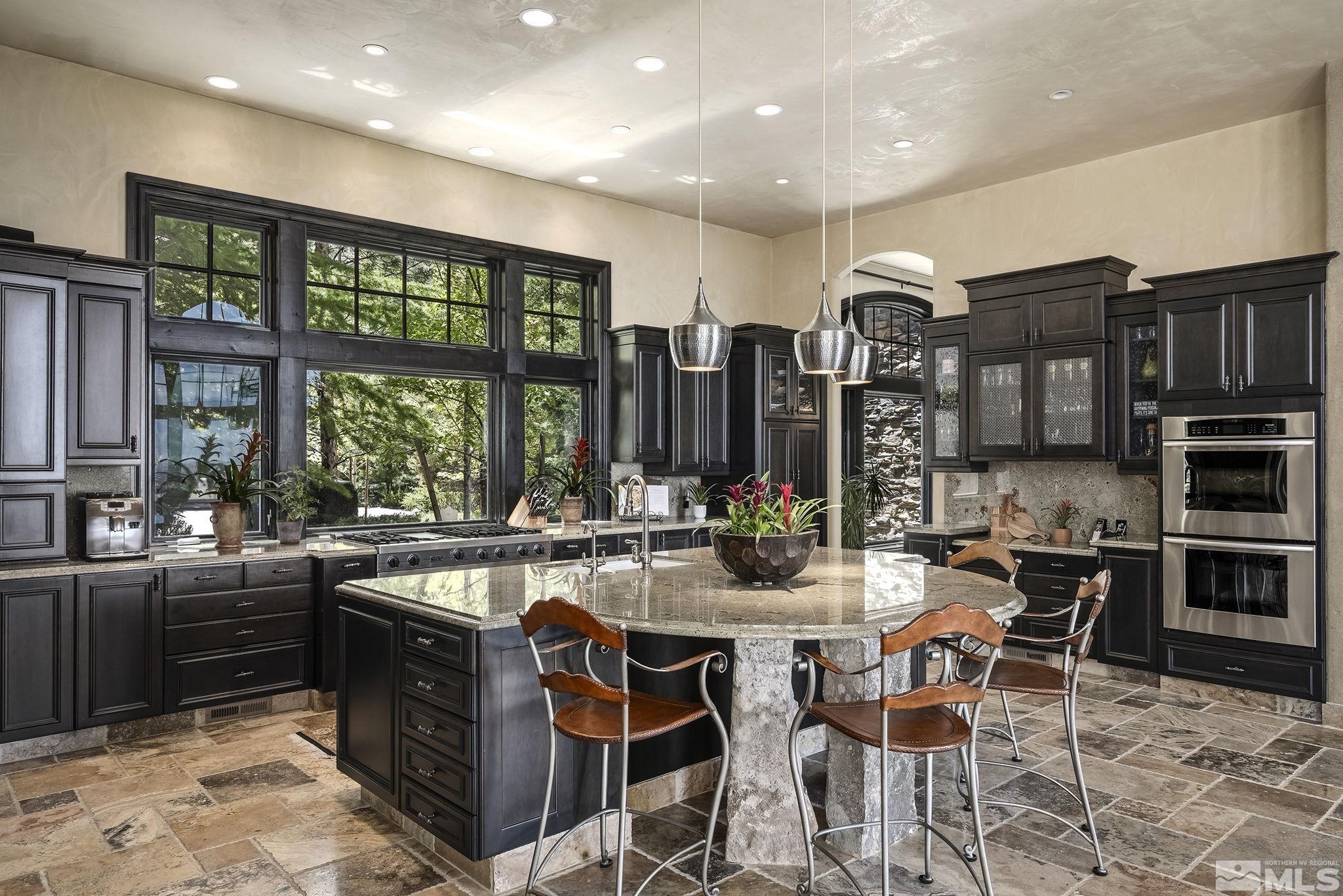 90 Hawken Road Reno, NV 89519 - Photo 13 of 40 a very nice looking kitchen with a large window and stainless steel appliances