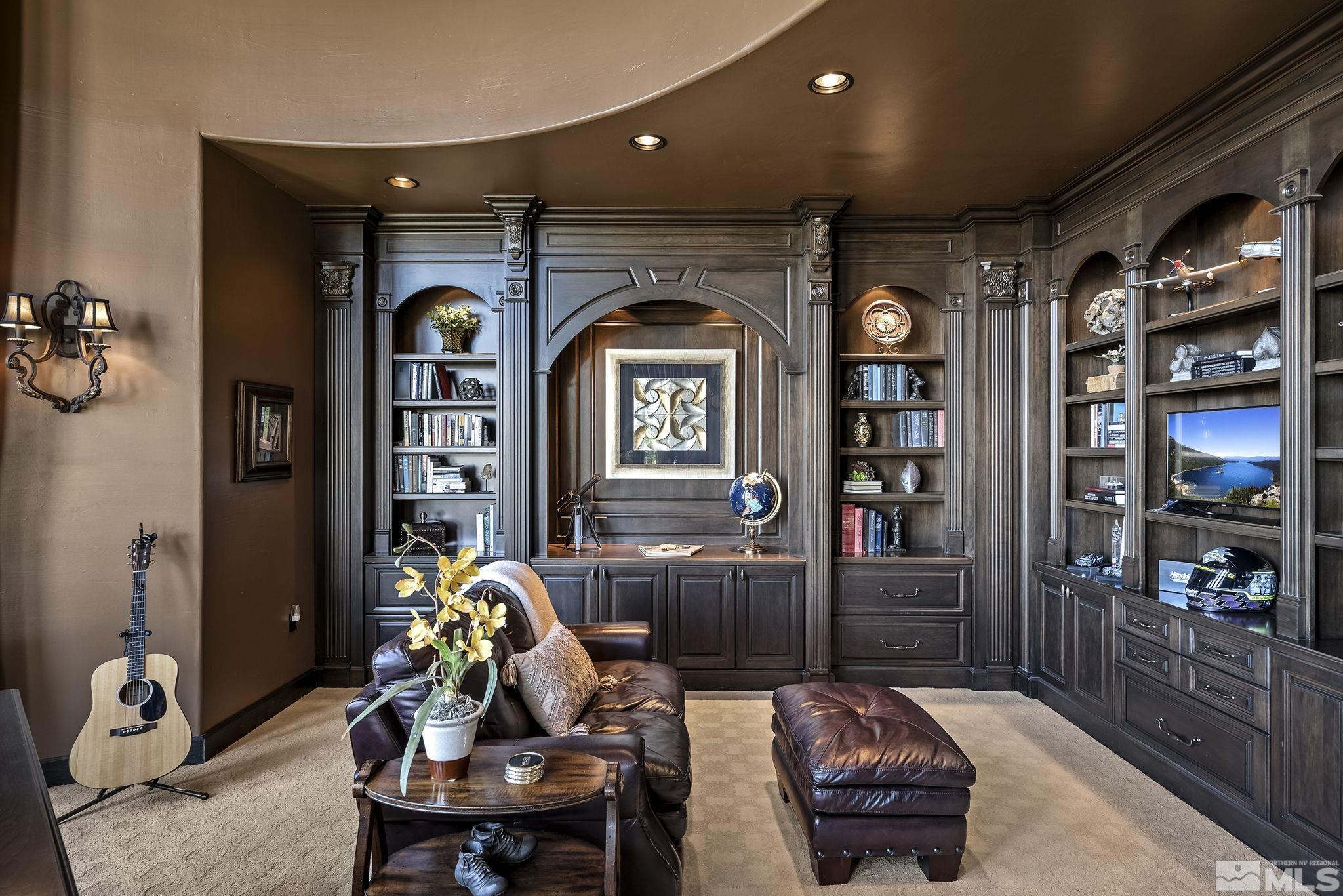 90 Hawken Road Reno, NV 89519 - Photo 17 of 40 a living room with furniture a bookshelf and kitchen view