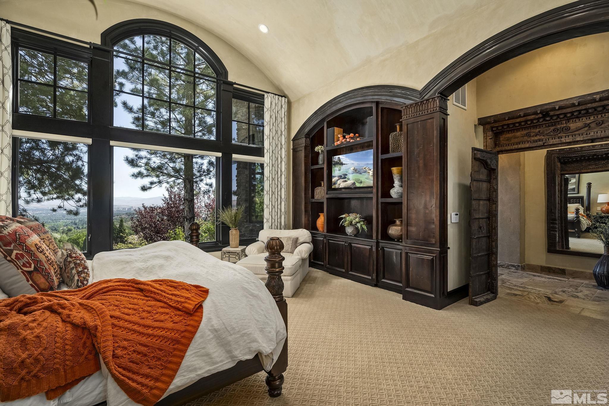 90 Hawken Road Reno, NV 89519 - Photo 19 of 40 a bedroom with a large bed and windows